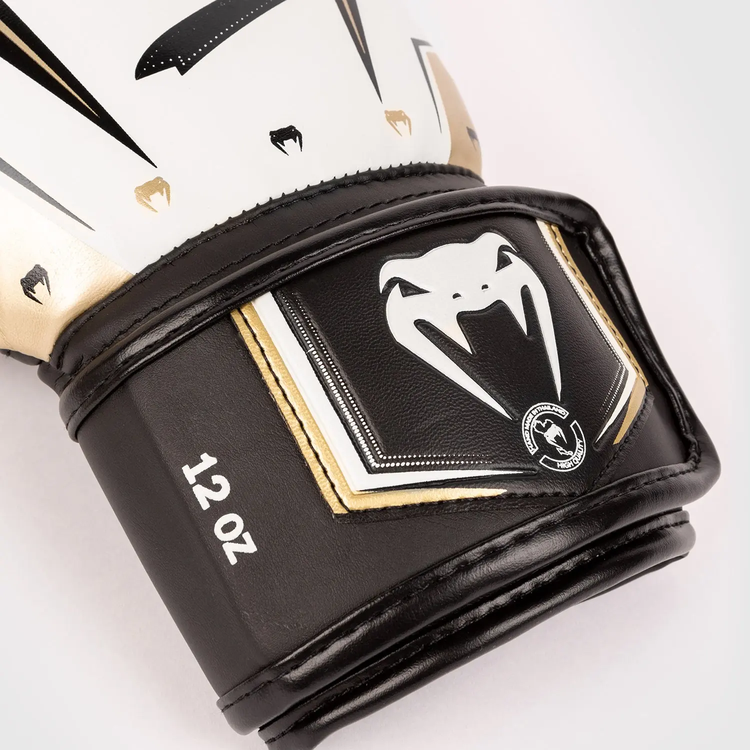 Venum Elite Evo Boxing Gloves - White/Gold в движение